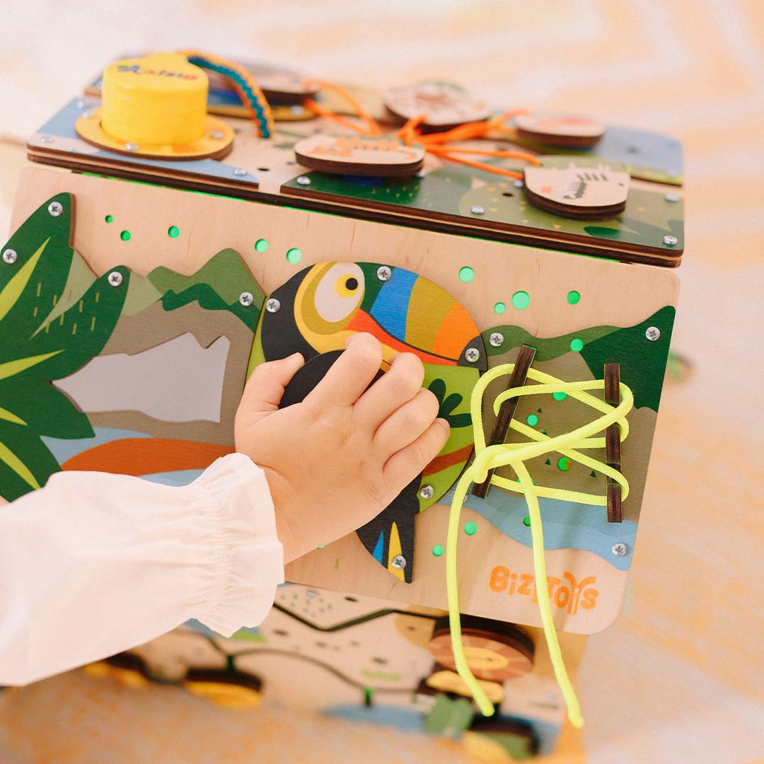 baby turning gear on jungle cube