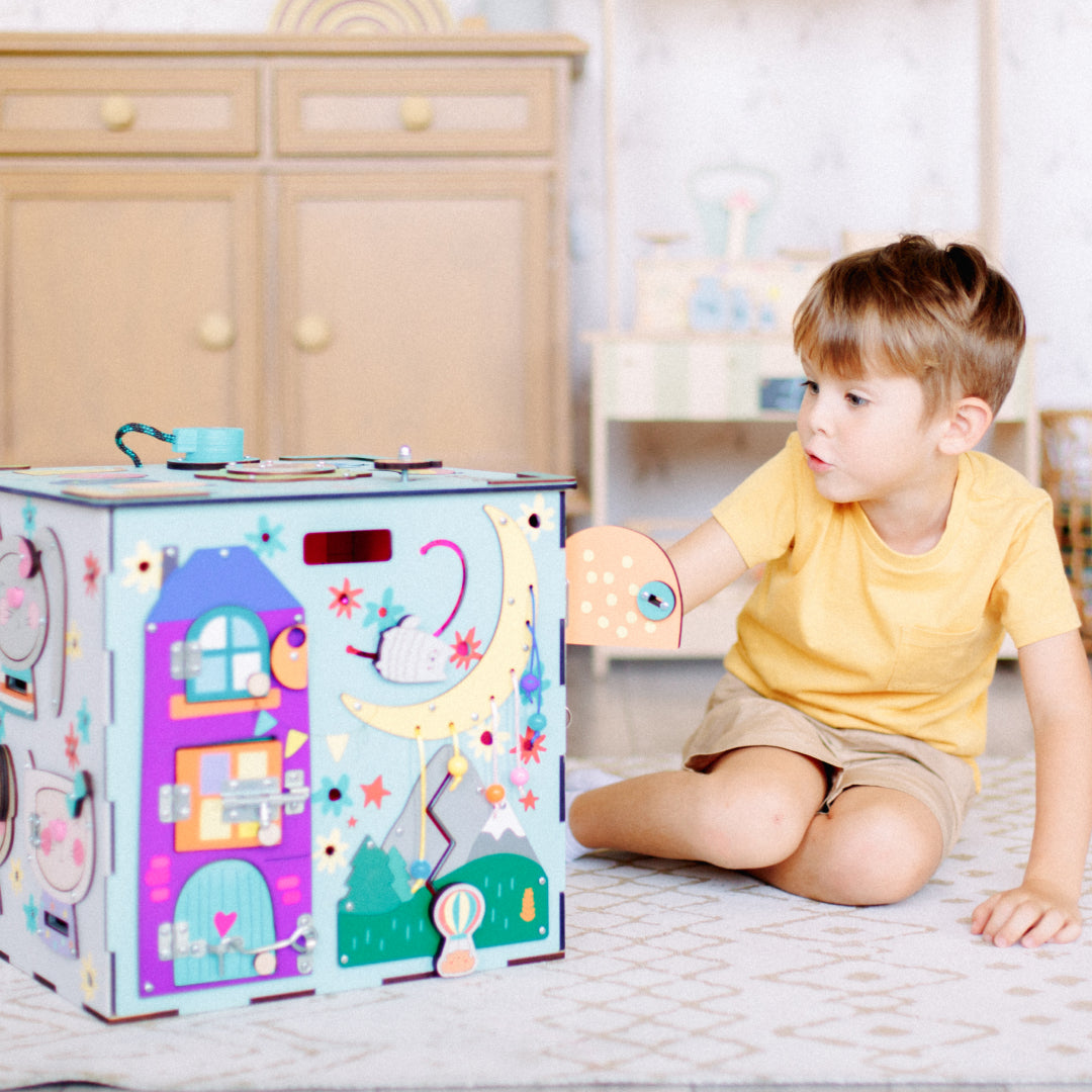 boy turning light switch on cube
