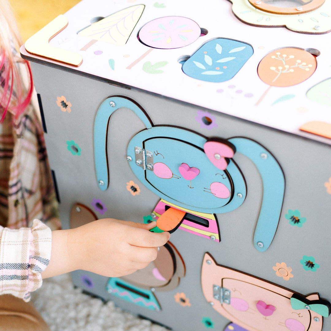 toddler with bunny activity cube