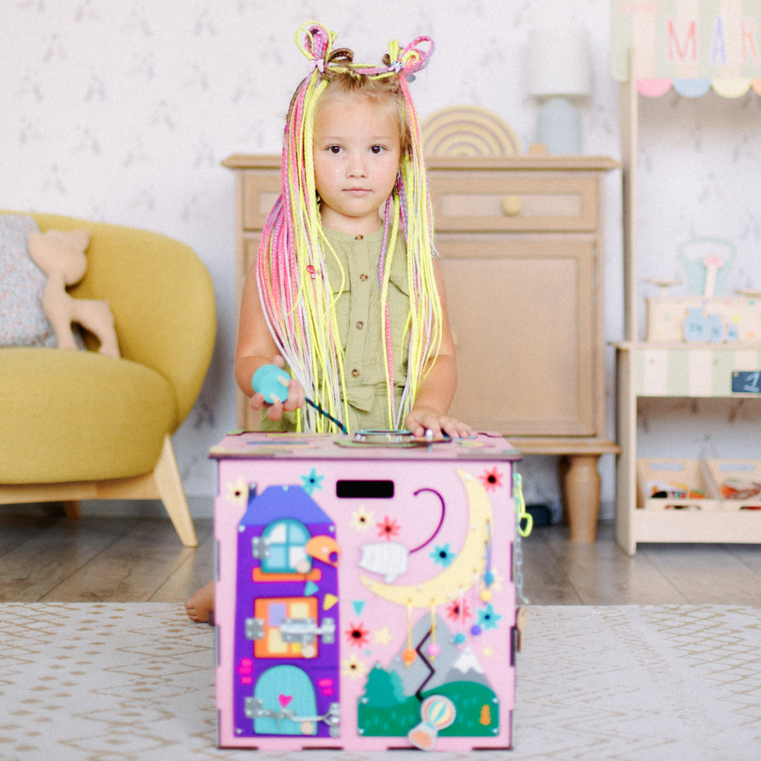 girl playing with zipper on cube