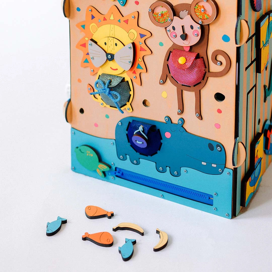 large wooden activity cube with learning toy