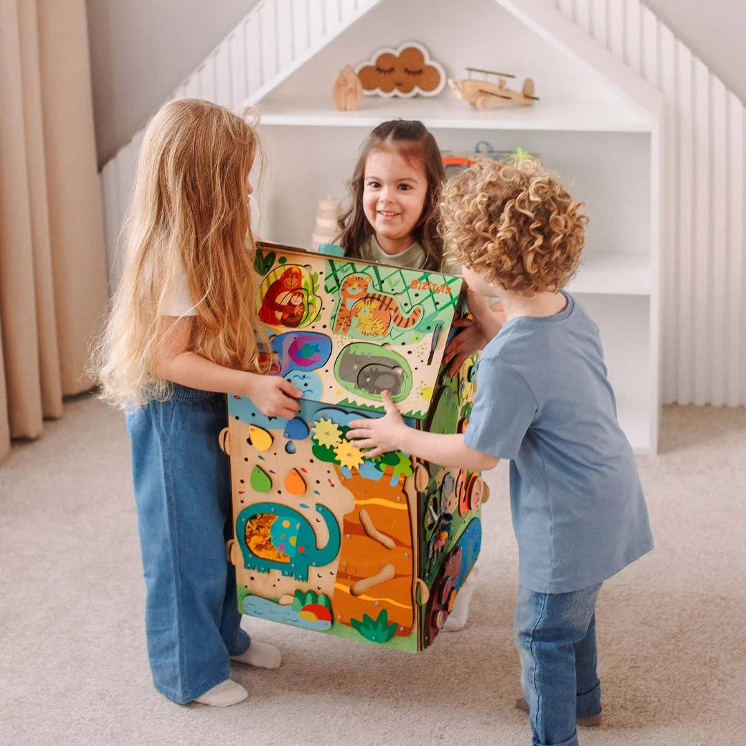 Kids playing together with Montessori busy board