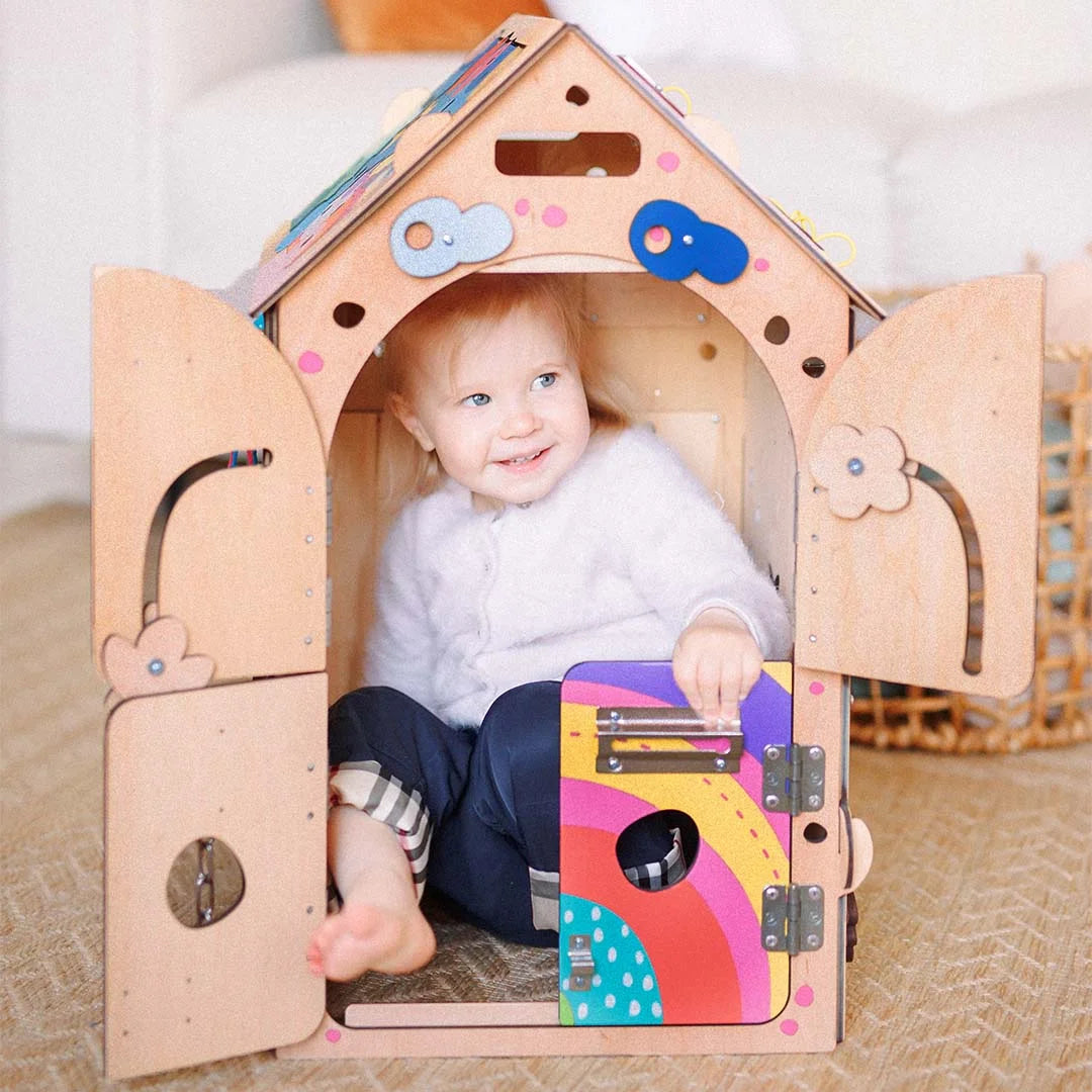 toddler opening busy house doors