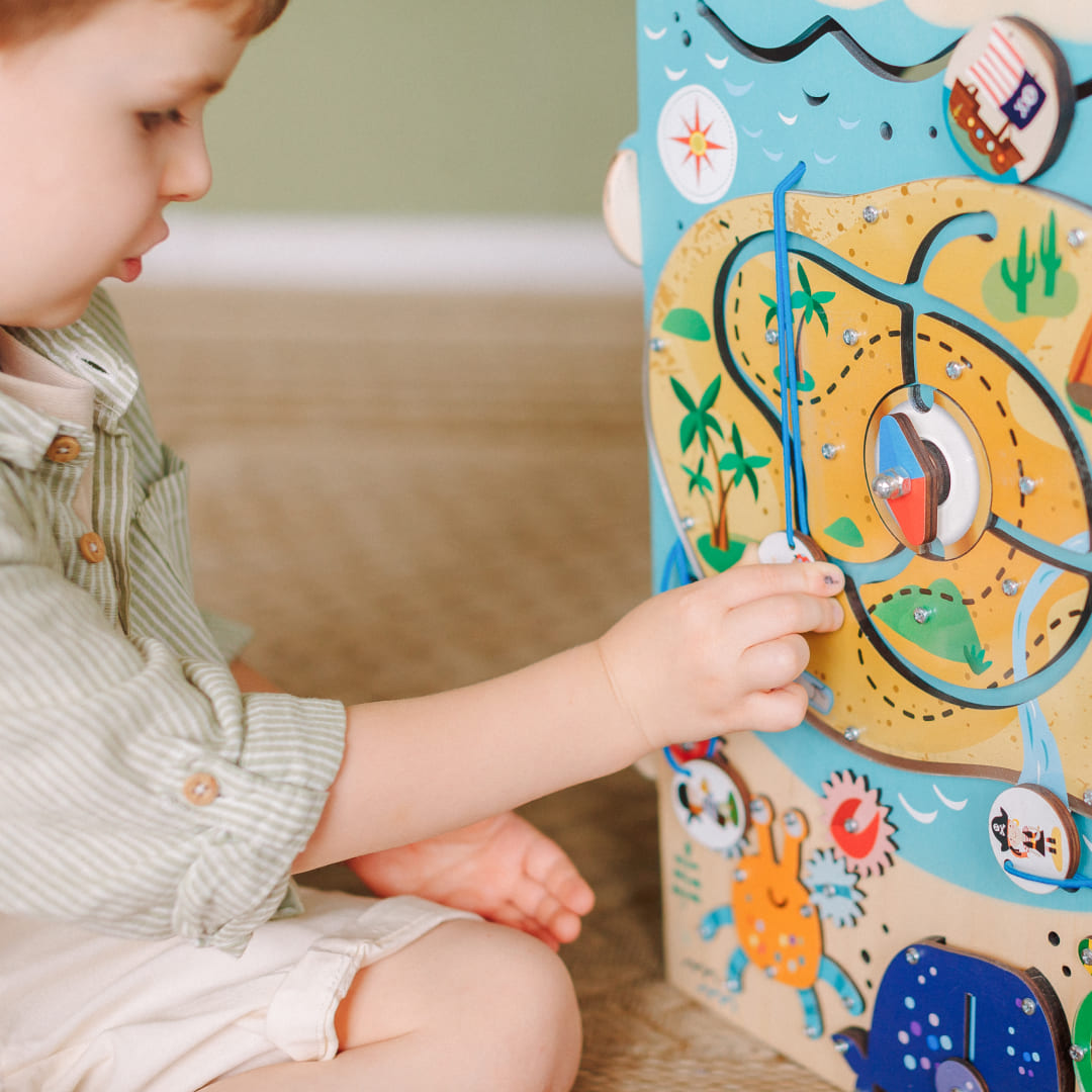 child building logic with pirate board maze