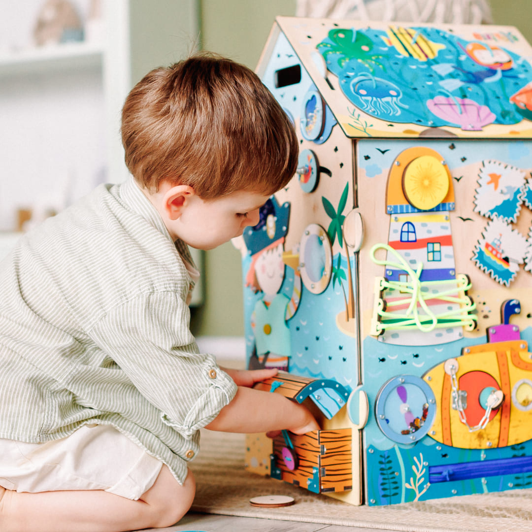 toddler exploring pirate montessori toy