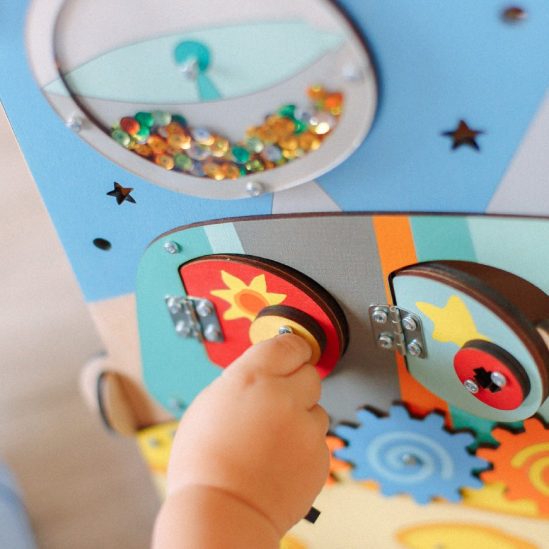 wooden activity board with space theme